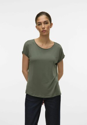 Green short-sleeve t-shirt with a round neck and rolled cuffs, made from a soft, smooth fabric. Worn with dark denim jeans.