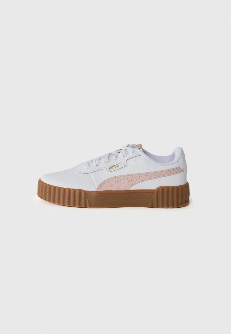 White sneaker with pink accents, textured synthetic upper, padded collar, and a ridged gum rubber sole. Features brand logo on side.