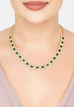 Gold-tone necklace featuring emerald-cut green gemstones set in rectangular frames, with a braided chain design.