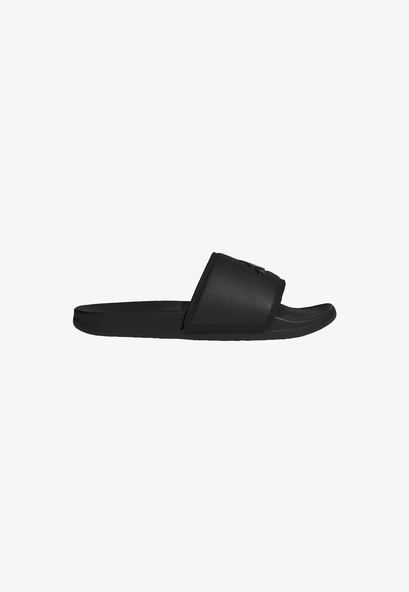Black slide sandals with a textured upper strap and a smooth sole. The design features a minimalist style and rounded shape.