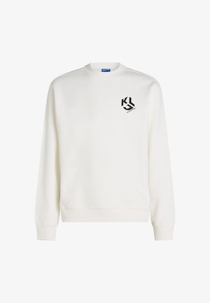 Balta ilgaaėlė sportinė palaidinė su apvaliu kaklu, sukvėpytomis rankovėmis ir apatine dalimi, turi mažą juodą logotipą viršutinėje kairėje krūtinės pusėje.