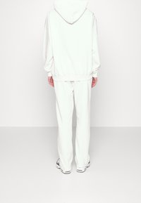 Pegador Jersey con capucha - white