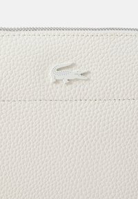 Lacoste Delninukė - farine/marine