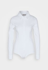 Body blanc à manches longues avec boutons, col pointu et poignets, présenté sur un fond uni.