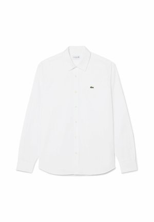 Camicia bianca a maniche lunghe con bottoni, colletto appuntito e piccolo logo verde di coccodrillo sul petto sinistro.