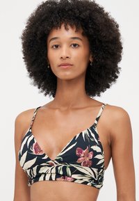 Black floral bikini top featuring a triangular design, thin straps, and a gathered front. The pattern includes pink and green tropical leaves.