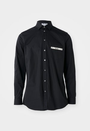 Black long-sleeve button-up shirt with a collar, featuring a silver banded pocket detail. Smooth fabric, classic fit, and button closure.