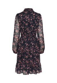 Floral patterned dress with long, sheer sleeves, a collar, and a cinched waist, featuring a tiered hem and a dark navy background.