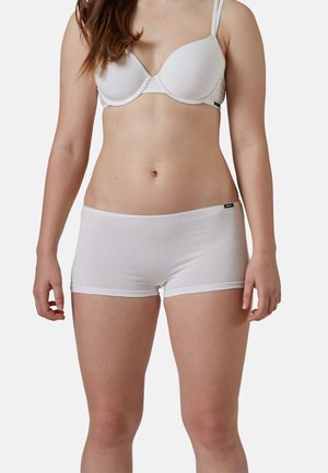 White cotton bra and boyshorts set, featuring a smooth texture with seamless edges and a discreet logo on the waistband of the shorts.