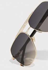 BOSS UNISEX - Occhiali da sole - gold-coloured/havana