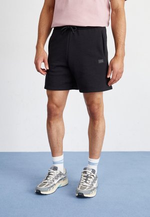 ALPHA ESSENTIALS - Pantaloni sportivi - black