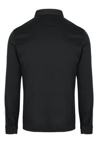 Zwarte lange mouwen polo shirt met een puntige kraag. Gemaakt van gladde stof, met knoopmanchetten en een effen ontwerp aan de achterkant.