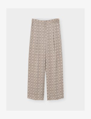 Pantalon beige à jambes larges et taille haute, avec un motif géométrique de carrés et d'arcs en lignes beige plus foncé.