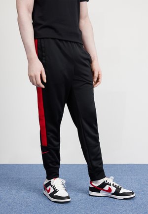 AIR JOGGER  - Spodnji deli trenirk - black/university red