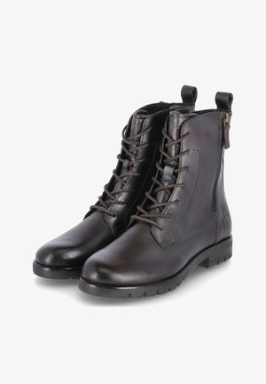 Bottines en cuir marron avec lacets et fermeture éclair sur le côté, présentant une texture lisse, un bout arrondi et une semelle robuste pour une bonne adhérence.