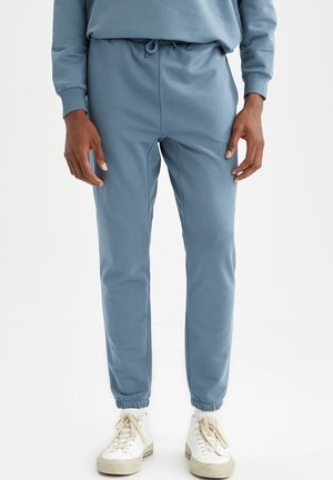 SLIM FIT - Tracksuit bottoms - indigo