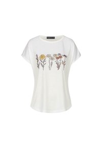 T-shirt blanc à manches courtes en tissu doux, avec un imprimé floral jaune, blanc et rouge sur le devant. Encolure ronde.