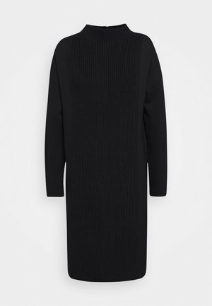 Zwarte midi-jurk met lange mouwen, een textuurgebreid paneel in het midden aan de voorkant en een col kraag.