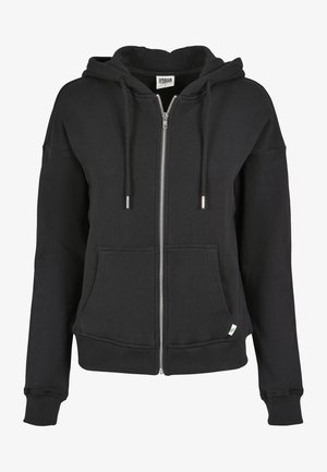 Mustast puuvilla segust valmistatud kapuutsiga tõmbluku ees, millel on nöörid, eeskojad ja soonikkudega varrukate ning helbega allserv. Hõbedased tõmblukud.