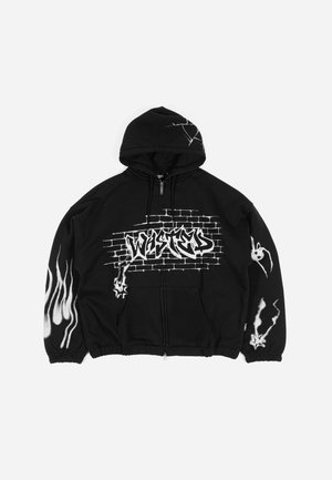 Black zip-up hoodie featuring graffiti-style "WISTED" text, flame graphics, and textured brick pattern. Adjustable hood and cuffs.