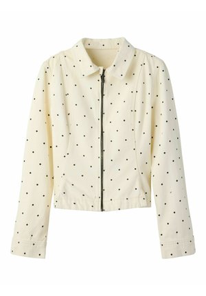 Cremefarbene Langarmjacke mit schwarzen Punkten, vorderem Reißverschluss und klassischem Kragen.