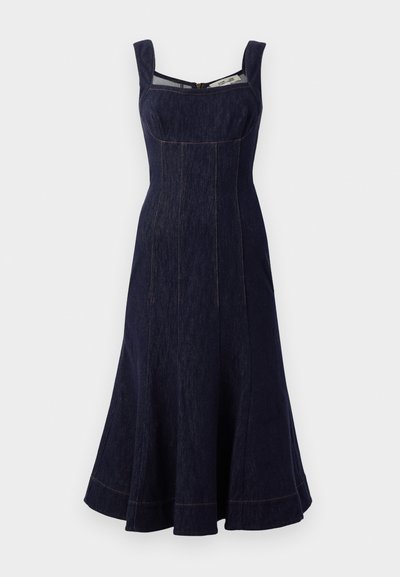 Laivastonsininen farkumekko neliömäisellä pääntiellä, leveillä kahvoilla, hulmuavalla polvipituisella hameella ja erottuvalla ompeleella. Vetoketjukiinnitys takana.