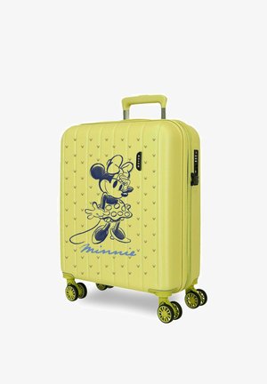 Maleta rígida amarilla con diseño de Minnie Mouse, firma azul, cuatro ruedas dobles giratorias y asa extensible.