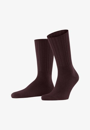 Braune gerippte Socken mit einem Design bis zur Mitte der Waden, die eine glatte Textur und eine nahtlose Zehenkonstruktion für Komfort und Haltbarkeit aufweisen.