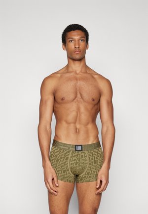 Groene boxershorts met een geometrisch patroon, middellange pasvorm, elastische tailleband en een merklabel aan de voorkant. Glad fabrieksweefsel.