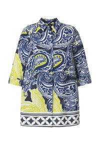 Skjorte med brede ærmer og knapper foran, med markante blå og gule paisley- og blomsterprint samt en geometrisk kant forneden.