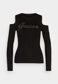 Zwarte lange mouwen top met koude schouders, versierd met een rhinestone 'Guess' logo op de borst, ronde halslijn en aangesloten silhouet.