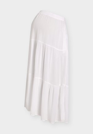 White tiered maxi skirt with elastic waistband and soft, crinkled fabric texture shown from side.