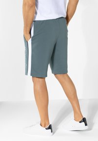 Bench Tracksuit bottoms - hellpetrol