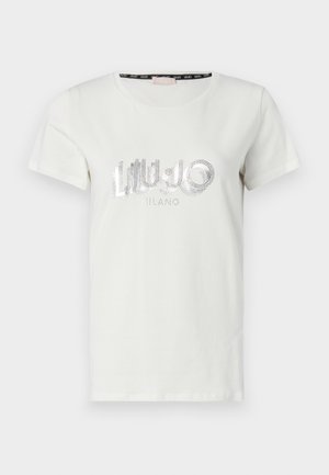 T-shirt bianca in cotone a maniche corte, con un logo in strass argentati "LIU JO MILANO" in un font giocoso sulla parte anteriore.