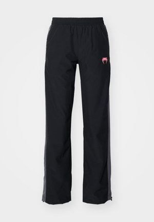 Čierne outdoorové nohavice s elastickým pásom, bočnými vreckami a ružovým logom. Majú rovný strih a kontrastné šedé akcenty.