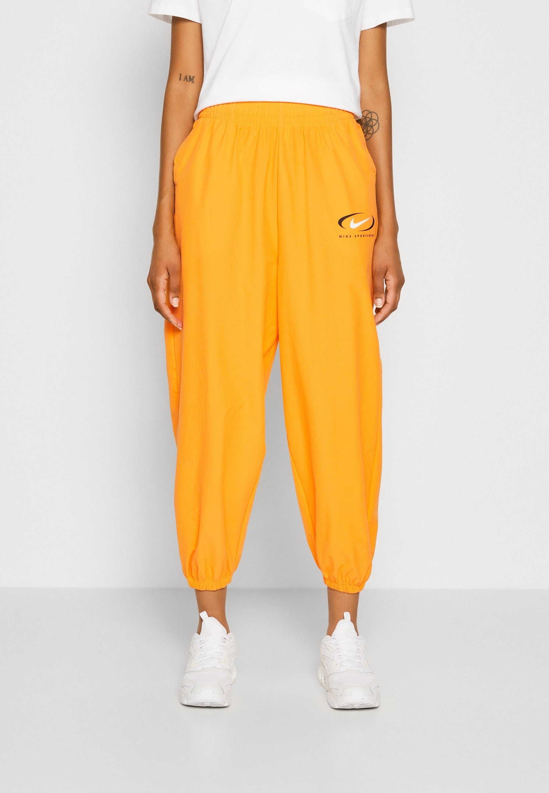 orange nike tracksuit bottoms