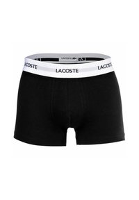 Čierne bavlnené boxerky s bielym elastickým pásom, ktorý obsahuje čierne logo Lacoste. Bez vzorov alebo ďalších akcentov.
