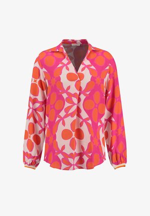 Blouse à manches longues avec un motif floral abstrait rose et orange, col en V et poignets froncés.