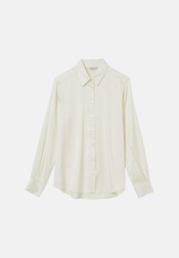 Chemise crème à manches longues, boutonnée, avec col et poignets, présentée à plat sur fond blanc.