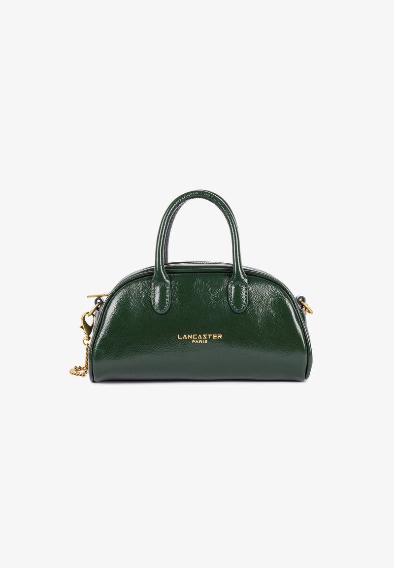 Borsa a tracolla in pelle verde dalla forma rotonda, con doppio manico superiore e logo dorato in rilievo. Presenta una tracolla a catena removibile e una finitura lucida.