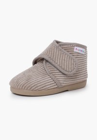 Pantofole beige per bambini con esterno in tessuto a coste, chiusura a strappo, punta arrotondata morbida e suola in gomma flessibile.