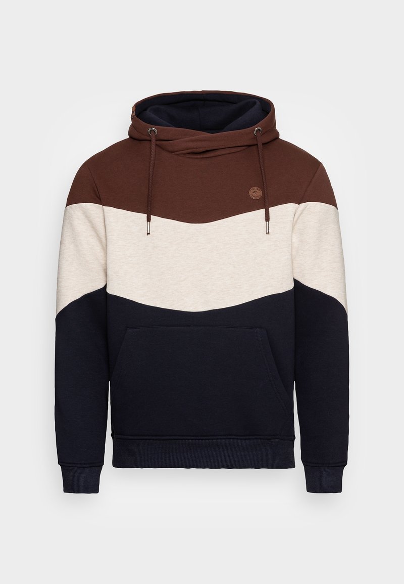 Sweat à capuche bicolore avec des panneaux marron, crème et bleu marine. Tissu doux avec une poche avant et une capuche à cordon de serrage réglable. Détail logo rond.