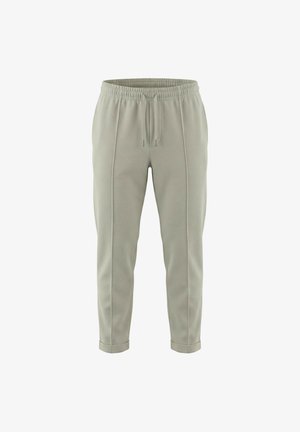 Pantaloni jogger grigi chiari a taglio affusolato con vita elasticizzata, coulisse, dettagli con cuciture verticali, tasche laterali e orli risvoltati.