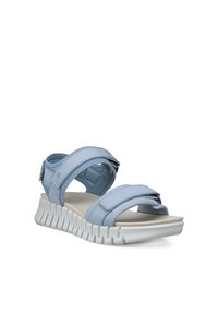 Ανοιχτό μπλε ρυθμιζόμενο σανδάλι με δύο επενδεδυμένους ιμάντες και χοντρή λευκή σόλα με αυλακώσεις, σχεδιασμένη για άνεση και στήριξη.