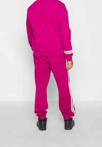 Nike Sportswear Träningsbyxor - mauve