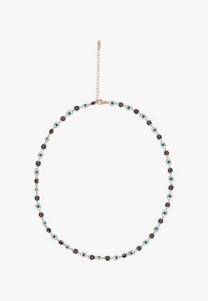 Kultainen ketjukaulakoru, jossa vuorottelevat siniset ja mustat pahat silmät -helmet sekä säädettävä lukko, valkoisella taustalla.