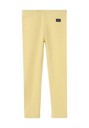 Gule leggings med elastisk taljebånd og lille sort rektangulært mærke mærket "P.O.P" nær taljen på højre side.