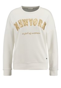 Sudadera blanca con el texto en relieve dorado "NEW YORK" y la frase bordada "está llena de sorpresas" debajo. Presenta un escote redondo y puños acanalados.