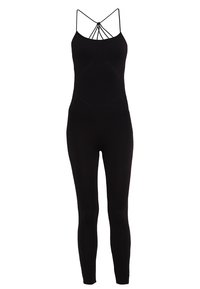 Combinaison noire sans manches avec fines bretelles et un détail à lanières dans le dos, cintrée sur les jambes et la taille.
