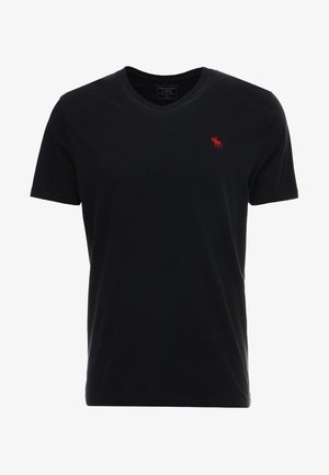 Zwart katoenen T-shirt met een V-hals, korte mouwen en een klein rood logo op de linkerborst. Gladde textuur en klassieke pasvorm.